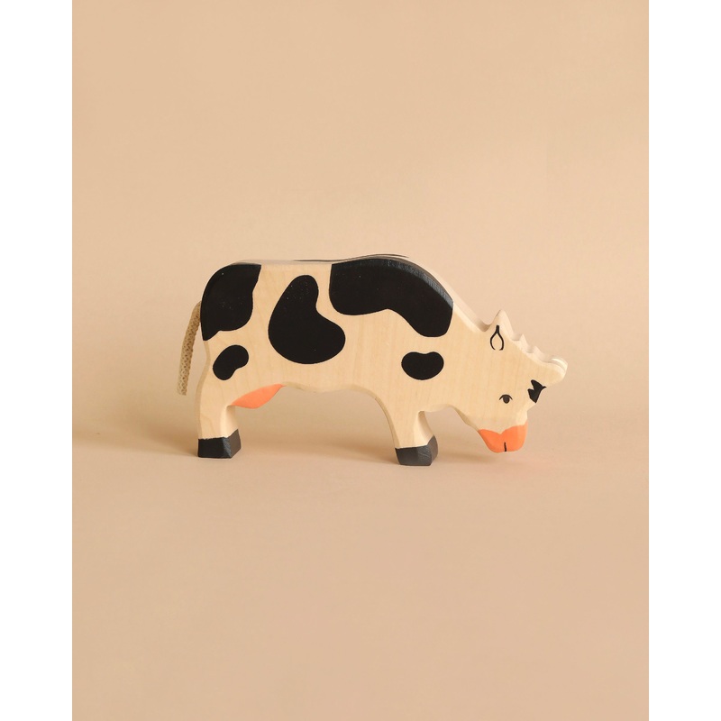 Holztiger Grazing Black Cow